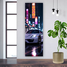 Lade das Bild in den Galerie-Viewer, Leinwandbild Eleganter Sportwagen bei Nacht in der Stadt Panorama Hoch