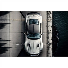 Lade das Bild in den Galerie-Viewer, Leinwandbild Elegantes Auto auf Brücke mit Wasser im Hintergrund Querformat