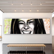 Lade das Bild in den Galerie-Viewer, Acrylglasbild Junge Frau zeigt rebellische Geste Panorama