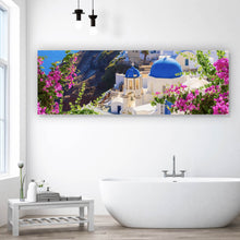 Lade das Bild in den Galerie-Viewer, Acrylglasbild Malerische Küstenstadt mit blauen Kuppeln und Blumen Panorama