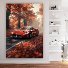 Lade das Bild in den Galerie-Viewer, Leinwandbild Roter Sportwagen fährt durch herbstlichen Wald Hochformat