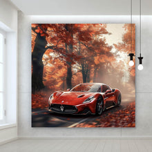 Lade das Bild in den Galerie-Viewer, Leinwandbild Roter Sportwagen fährt durch herbstlichen Wald Quadrat