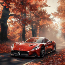 Lade das Bild in den Galerie-Viewer, Leinwandbild Roter Sportwagen fährt durch herbstlichen Wald Quadrat