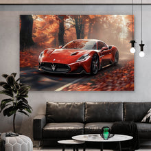 Lade das Bild in den Galerie-Viewer, Leinwandbild Roter Sportwagen fährt durch herbstlichen Wald Querformat