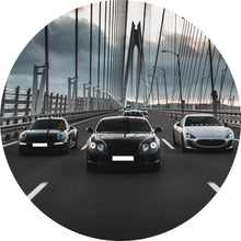 Lade das Bild in den Galerie-Viewer, Aluminiumbild Luxusautos in der Fahrt auf einer Brücke Kreis