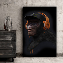 Lade das Bild in den Galerie-Viewer, Acrylglasbild Affe mit orangenen Kopfhörern Hochformat