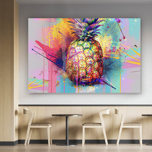 Leinwandbild Bunte Ananas mit knalligen Farbspritzer Hintergrund Querformat