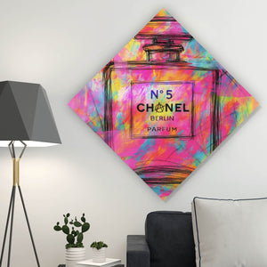 Aluminiumbild Parfum vor farbenfrohem Hintergrund Raute
