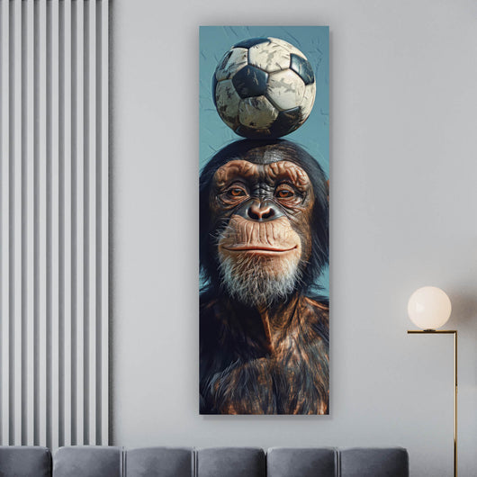 Leinwandbild Frecher Schimpanse mit Fußball Panorama Hoch