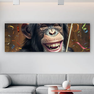 Leinwandbild Schimpanse feiert mit Lutscher und Partyhut Panorama