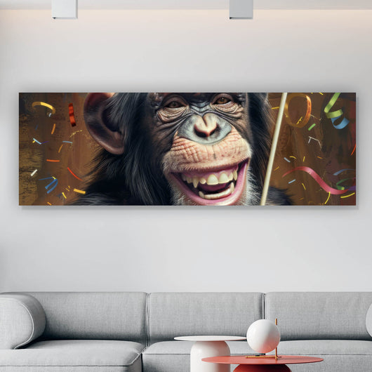 Leinwandbild Schimpanse feiert mit Lutscher und Partyhut Panorama