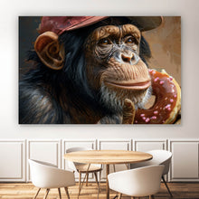 Lade das Bild in den Galerie-Viewer, Leinwandbild Schimpanse genießt Donat Querformat
