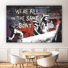 Lade das Bild in den Galerie-Viewer, Spannrahmenbild Banksy - We&#39;re all in the same boat Querformat
