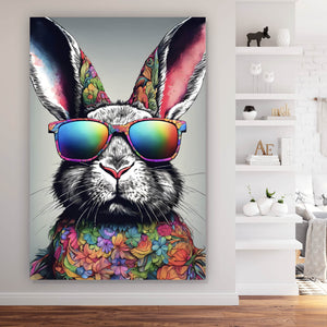 Leinwandbild Cooler Hase mit Regenbogenbrille Hochformat