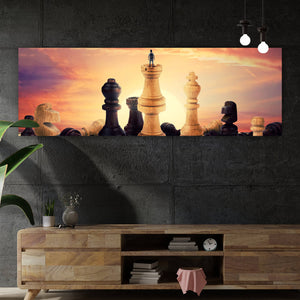 Leinwandbild Gigantische Schachfiguren vor Sonnenaufgang Panorama