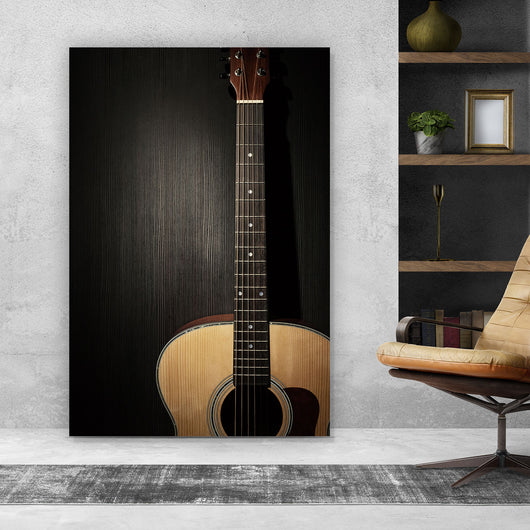 Leinwandbild Gitarre auf schwarzem Hintergrund Hochformat