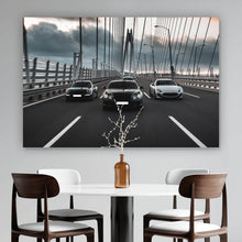 Lade das Bild in den Galerie-Viewer, Aluminiumbild Luxusautos in der Fahrt auf einer Brücke Querformat
