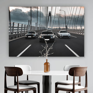Acrylglasbild Luxusautos in der Fahrt auf einer Brücke Querformat