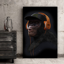 Lade das Bild in den Galerie-Viewer, Acrylglasbild Affe mit orangenen Kopfhörern Hochformat
